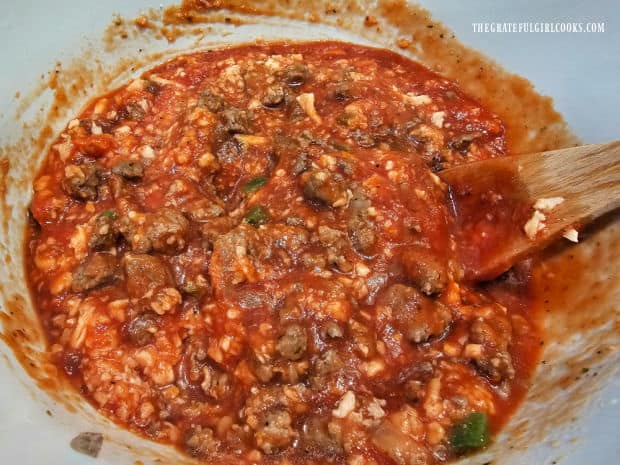 Cheese, sauce and meat mixture are combined in a large bowl.