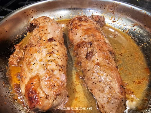 Maple orange glazed tenderloin rests in pan after baking.