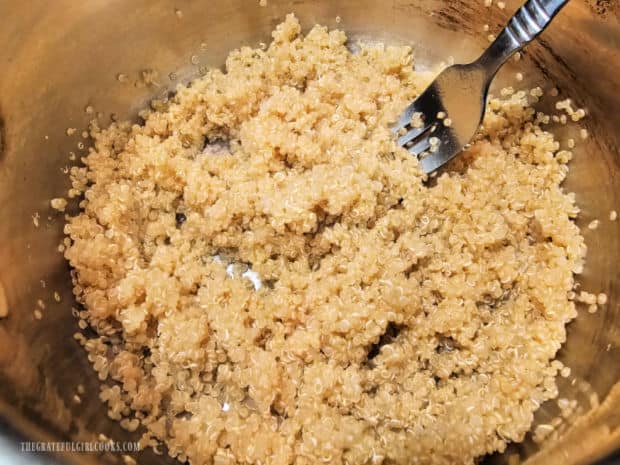 When quinoa is done cooking (and water is absorbed), it is fluffed with a fork.