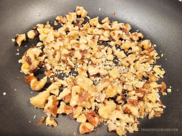 Chopped walnuts are lightly "toasted" in a dry skillet for a few minutes.