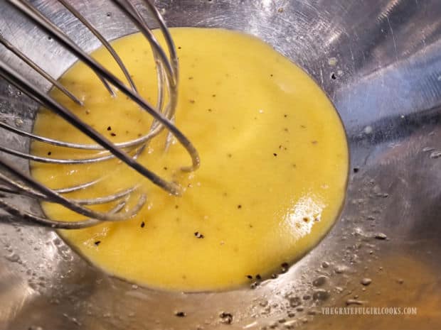 Once salad dressing has been emulsified by whisking, it is ready to add to the salad.