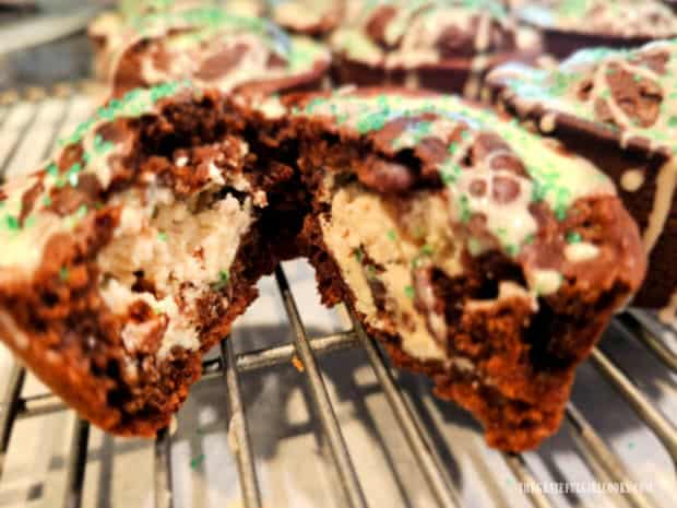 One of the chocolate Irish cream muffins cut in half reveals surprise filling inside.