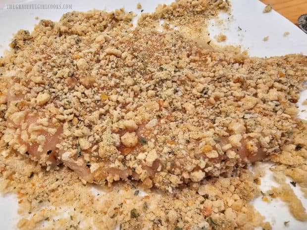 Honey mustard coated chicken is dredged in seasoned breadcrumbs on both sides.