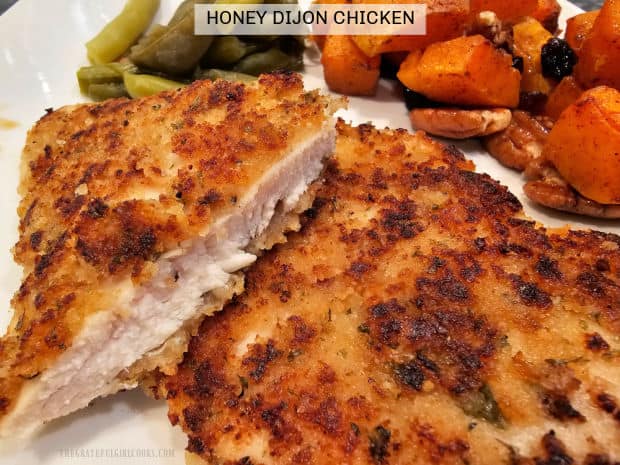 Make easy Honey Dijon Chicken for two, featuring pan-seared chicken breasts, coated in seasoned breadcrumbs and honey mustard sauce.